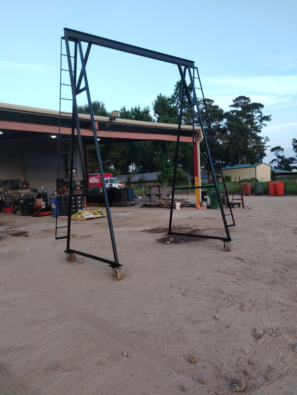 Assembled A-frame steel gantry crane standing outside the shop
