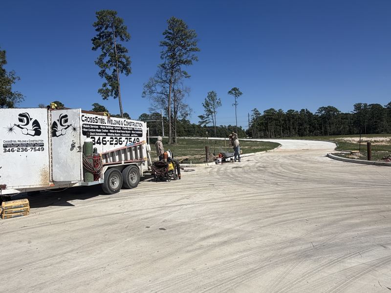 CrossSteel mobile welding trailer and crew installing park barrier gates