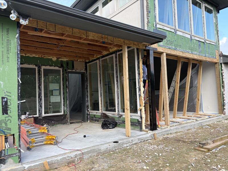 Steel support post and beam installed inside a wood-framed remodel